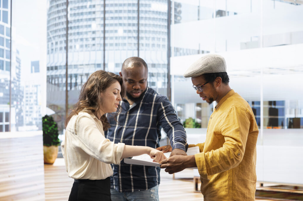 Professional_Team_Participates_In_Office_Tour_With_A_Real_Estate_Agent_original_2626298 (1)